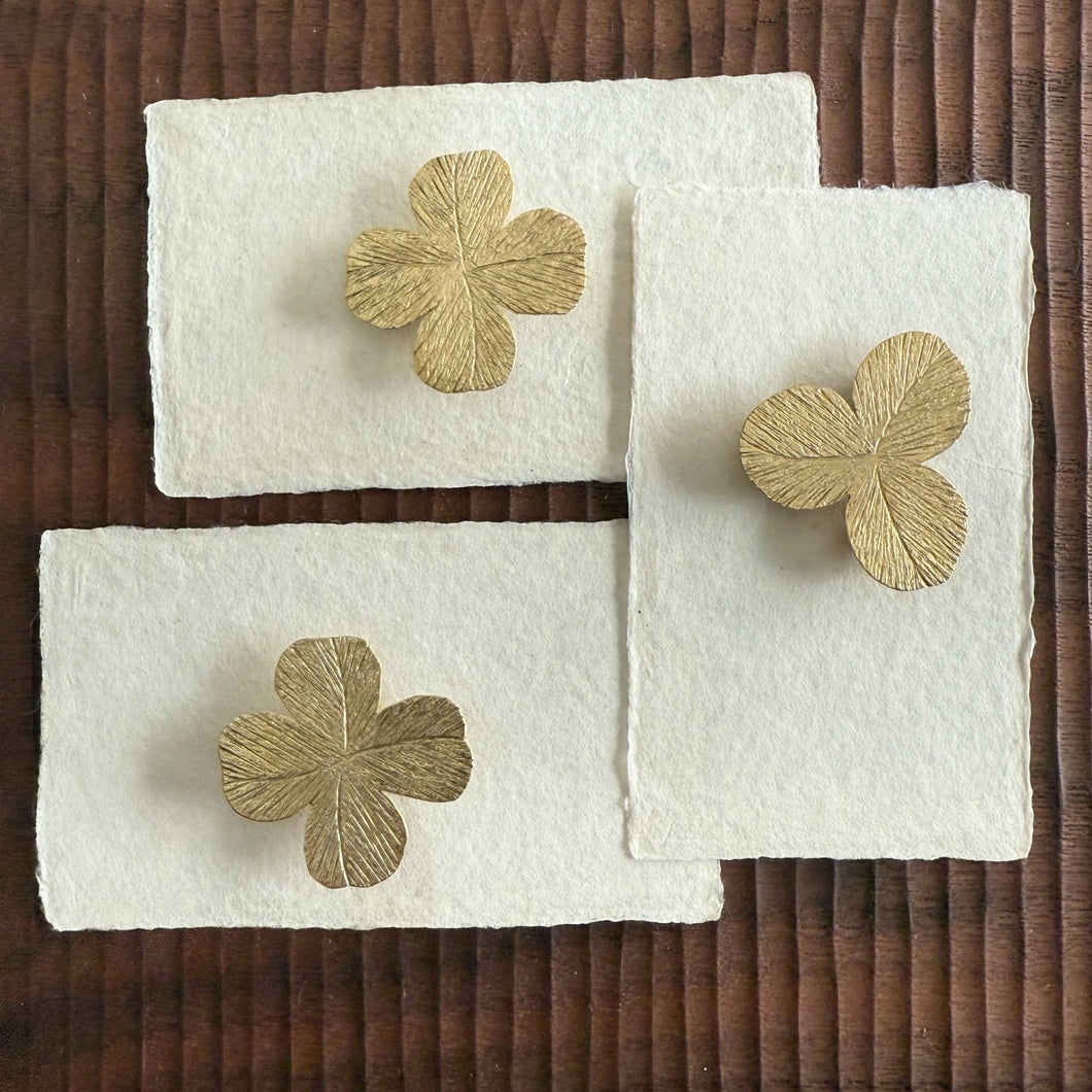 Brass clover brooches