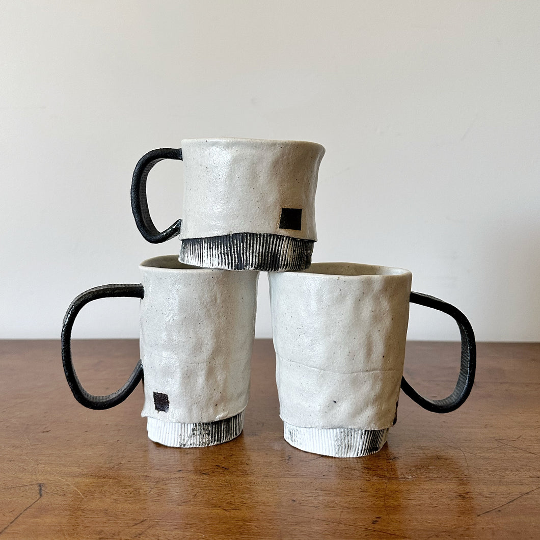 Naoko Rodgers black handle cups