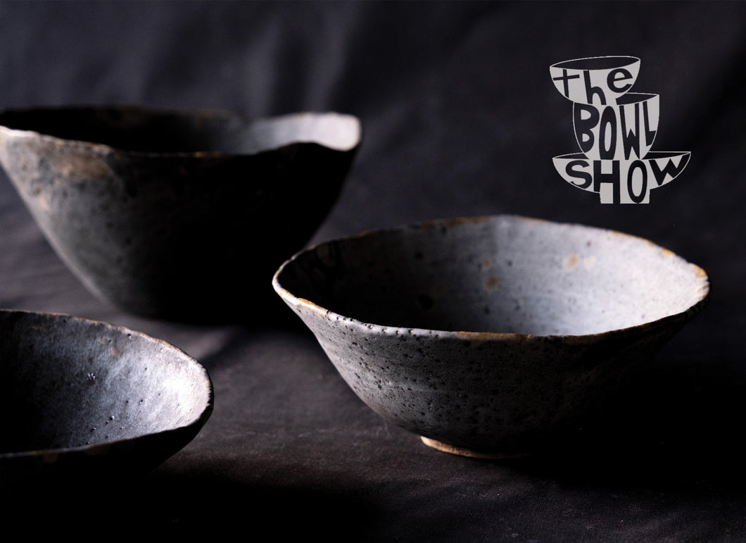 Three handmade ceramic bowls advertising the bowl show exhibition