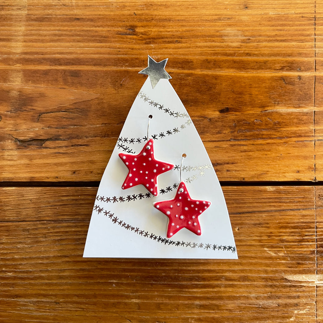 red spotty christmas star hanging earrings
